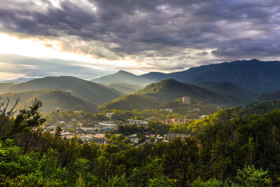 Resort Concierge Escapes Reviews features a panoramic Gatlinburg and Great Smoky Mountains view highlighting the destination's mountain setting.